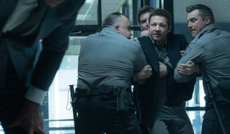 A tense confrontation between a man and a police officer inside a building.