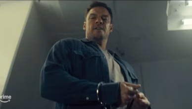 Reacher Episode 404 Preview featuring Jack Reacher looking down during a tense scene in “Karambits and Pieces” from Season 4 of Reacher.