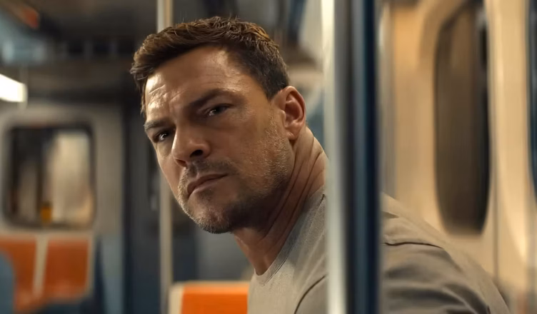 Reacher Season 4 Episode 1 image featuring Alan Ritchson as Jack Reacher observing the passengers aboard a Philadelphia subway in “City of Brotherly Love.”