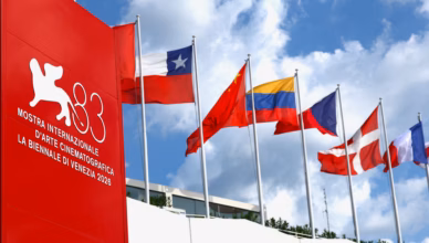 Venice Film Festival 2026 signage and international flags outside the Venezia 83 festival venue on the Lido