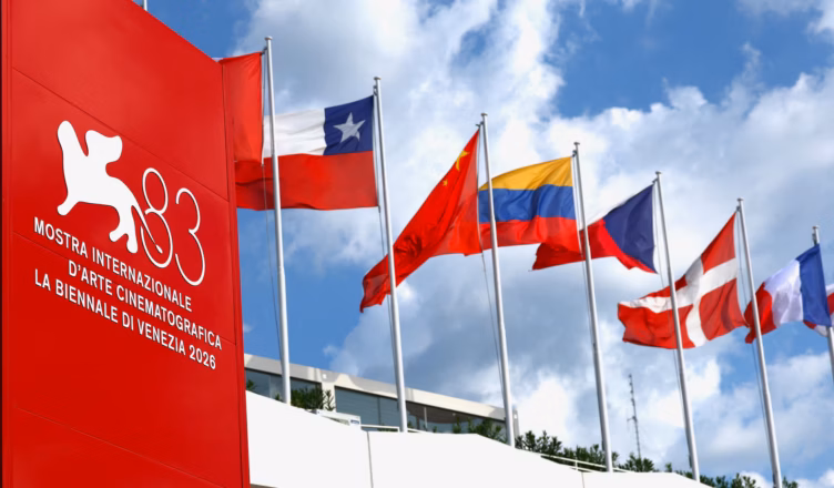 Venice Film Festival 2026 signage and international flags outside the Venezia 83 festival venue on the Lido