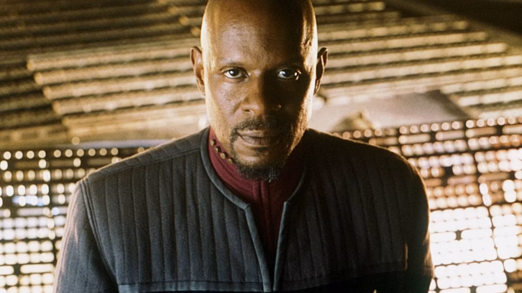 Benjamin Sisko as captain of Deep Space 9, reflecting his journey from grieving father and Starfleet commander to Emissary of the Prophets.