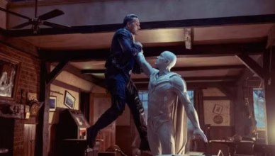 VisionQuest S1 E2 Analysis – White Vision lifts the Paladin off the ground during a confrontation inside a dimly lit room.